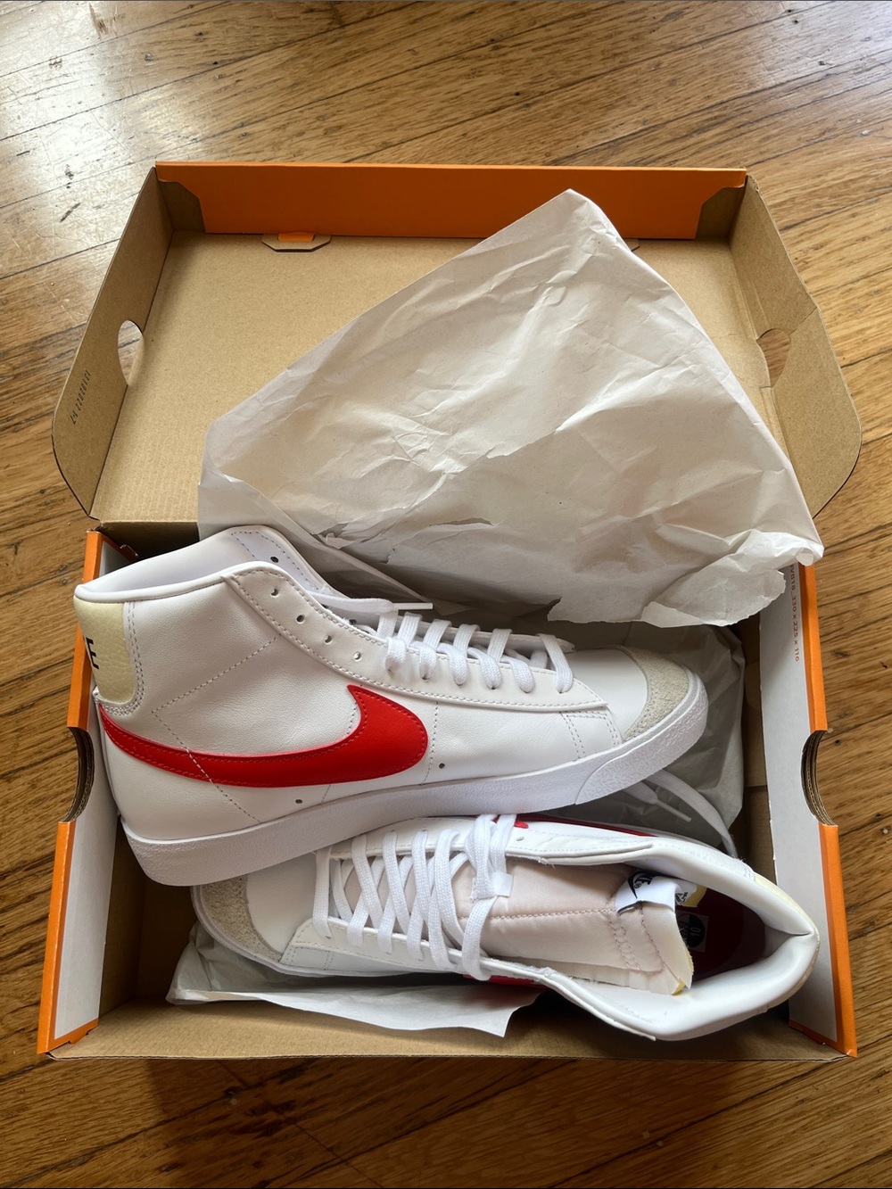 Nike White High-Top Sneakers with Red Swoosh